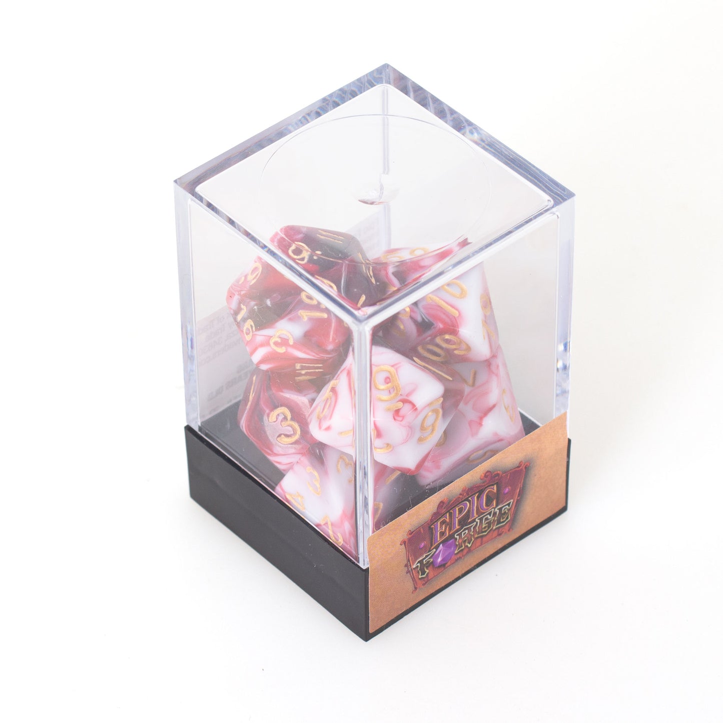 Lot de 7 dés multiformat en boîte – Cherry Cream – Jeu de rôle. Set rouge cerise et blanc crème effet marbré avec chiffres dorés (D4, D6, D8, D10, D00, D12, D20). Un design gourmand et raffiné parfait pour Donjons & Dragons, Pathfinder et autres jeux de rôle.