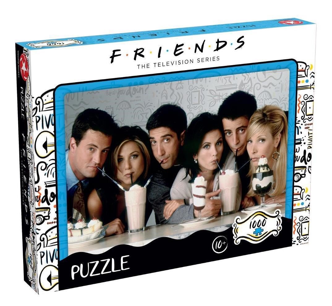 vPuzzle Friends – Milkshake – 1000 pièces – 68,3 x 48 cm – Officiel. Illustration culte des six amis partageant un moment convivial autour de milkshakes. Un puzzle collector idéal pour les fans de Friends.