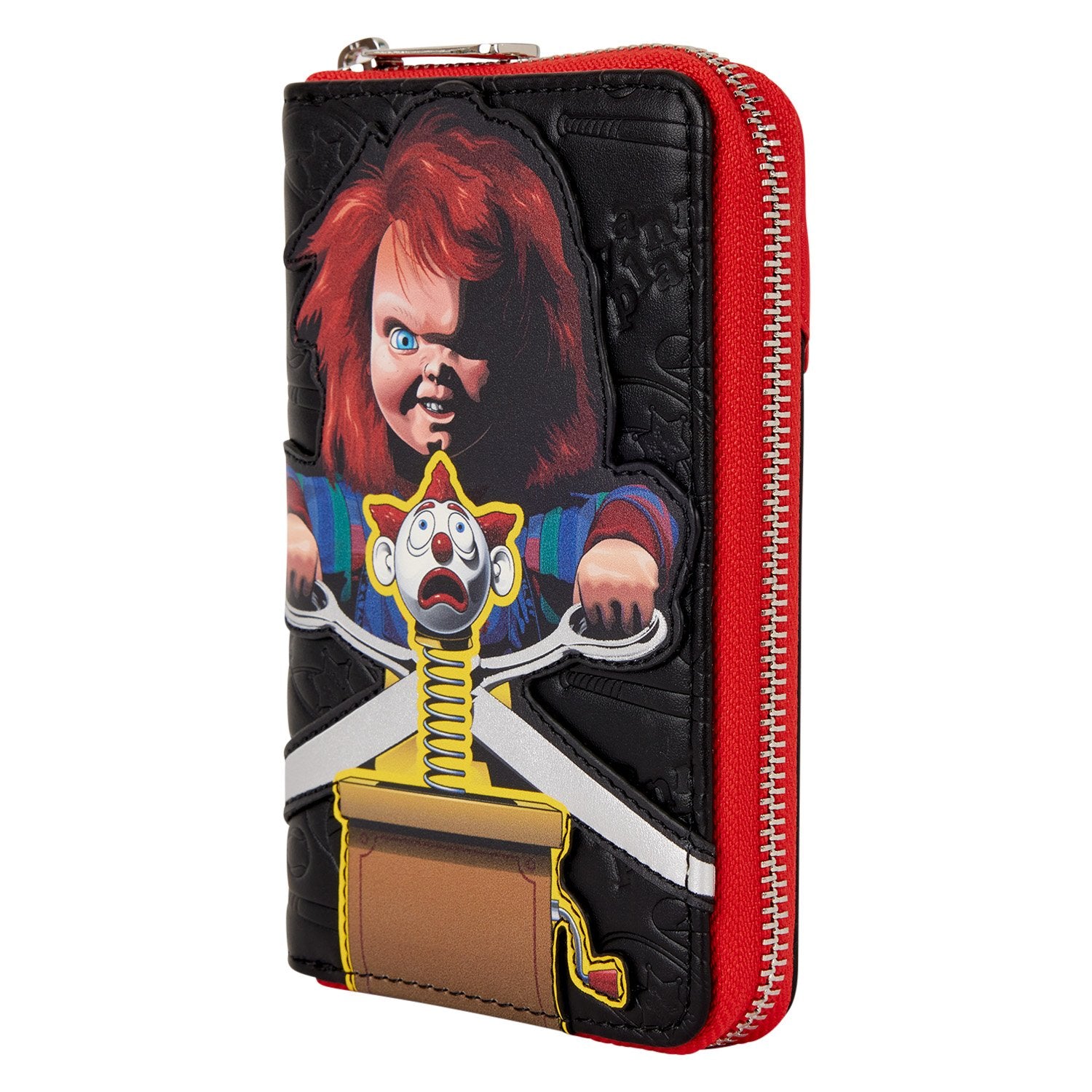 Portefeuille Loungefly – Chucky Jack In The Box – 15 x 10 cm. Portefeuille zippé en simili cuir noir et rouge, décoré de Chucky avec son Jack In The Box, intérieur coloré à motifs Good Guys.