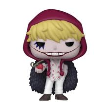 "Funko Pop! Corazon (1709) – One Piece. Figurine exclusive avec sticker Fall Convention NYCC 2024 – Limited Edition, représentant Corazon dans sa tenue emblématique avec capuche rouge et manteau noir à plumes. Édition rare pour les fans de One Piece et les collectionneurs de Funko."