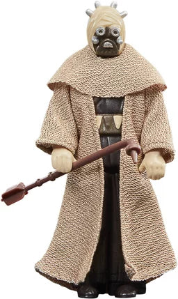 Figurine Star Wars The Book of Boba Fett – Tusken Warrior – Retro Collection – 9,5 cm – Hasbro. Guerrier Tusken avec tenue traditionnelle et gaderffii stick, au style vintage Kenner. Une figurine rétro parfaite pour les fans de Star Wars.