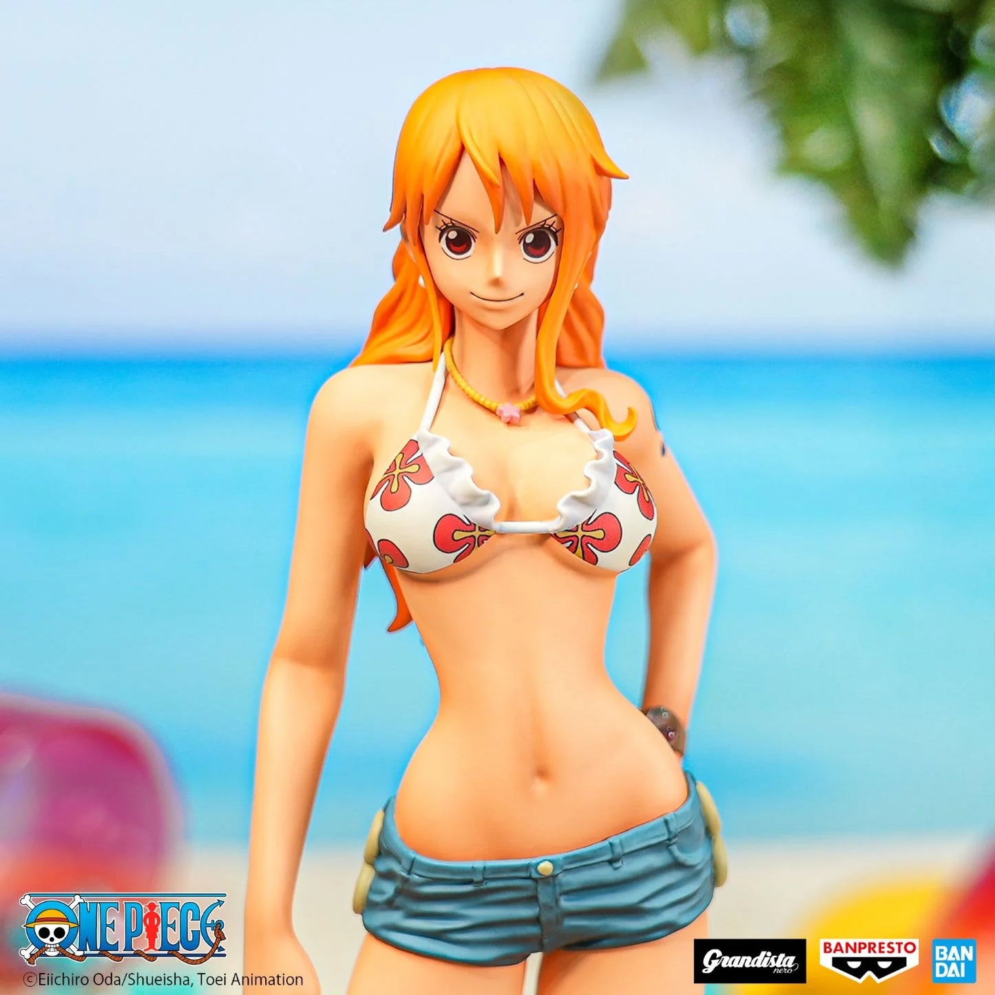 Figurine One Piece – Nami – Grandista Nero – 28 cm – Banpresto. Nami dans une pose élégante, vêtue de sa tenue estivale emblématique. Une figurine détaillée parfaite pour les fans de One Piece.