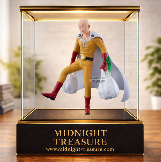 Figurine One Punch Man – Saitama – 20 cm – Banpresto. Saitama en tenue de héros portant des sacs de courses avec des légumes, scène humoristique fidèle à l’univers de la série.
