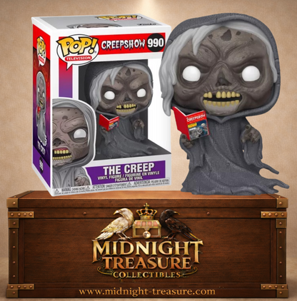 Funko Pop! N°990 The Creep de Creepshow, créature cadavérique en robe grise à capuche tenant un comic Creepshow rouge.