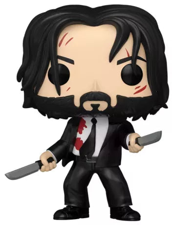 Funko Pop! John Wick 2 – John Wick (N°1763). Figurine de John Wick en costume noir taché de sang, armé de deux couteaux avec cicatrices au visage. Une pièce culte et intense pour les fans de la saga John Wick.