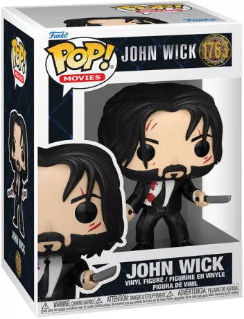 Funko Pop! John Wick 2 – John Wick (N°1763). Figurine de John Wick en costume noir taché de sang, armé de deux couteaux avec cicatrices au visage. Une pièce culte et intense pour les fans de la saga John Wick.