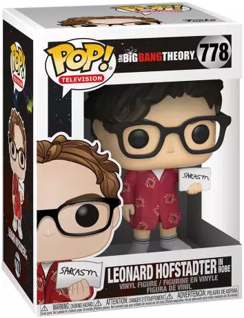 Funko Pop! The Big Bang Theory – Leonard Hofstadter (N°778). Figurine du physicien geek en peignoir rouge, tenant une pancarte “Sarcasm”, inspirée de la série culte.
