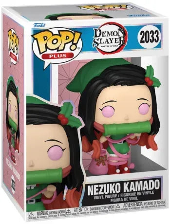 Funko Pop! Demon Slayer – Nezuko Kamado Christmas Edition (N°2033). Nezuko en tenue de Noël verte et rouge tenant un sac de cadeaux. Une version festive incontournable pour les fans de Demon Slayer.
