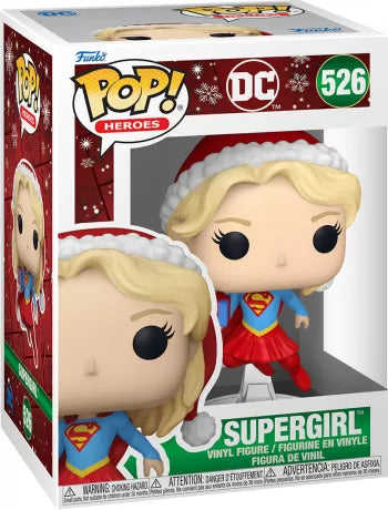 Funko Pop! DC Comics – Supergirl (Édition Noël) (N°526). Figurine festive de Supergirl en tenue de Noël, avec bonnet rouge et cape, édition spéciale Holiday.