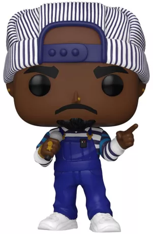 Funko Pop! Rocks – Tupac Shakur – N°387. Figurine de Tupac en salopette bleue et casquette rayée avec micro et bijoux. Une Pop! puissante et fidèle à l’icône du rap.