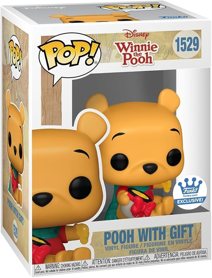 Funko Pop! Disney – Winnie l’Ourson (N°1529) – avec cadeau. Winnie assis avec pot de miel enrubanné, foulard vert et tenue hivernale. Une figurine douce et festive pour les fans de Disney.

