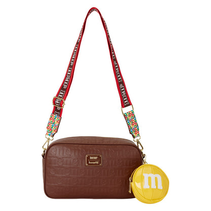 Sac à bandoulière Loungefly M&M’s avec porte-monnaie. Design chocolat embossé avec pastilles colorées et doublure intérieure exclusive. Accessoire collector parfait pour les fans de M&M’s.