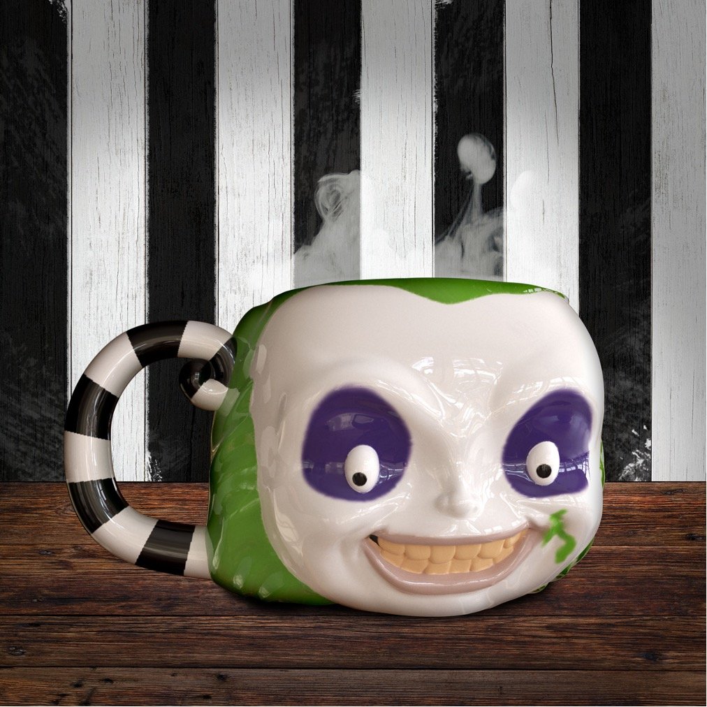 Mug 3D Beetlejuice – Beetlejuice – 300 ml – Officiel. Mug en céramique sculpté avec visage emblématique de Beetlejuice et poignée rayée. Un must-have pour les fans de Tim Burton et de cinéma culte.