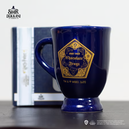 Mug chaudron Chocogrenouille Harry Potter en céramique bleue, design inspiré du Wizarding World avec logo doré, produit sous licence officielle.