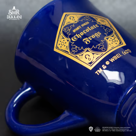 Mug chaudron Chocogrenouille Harry Potter en céramique bleue, design inspiré du Wizarding World avec logo doré, produit sous licence officielle.
