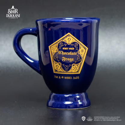 Mug chaudron Chocogrenouille Harry Potter en céramique bleue, design inspiré du Wizarding World avec logo doré, produit sous licence officielle.