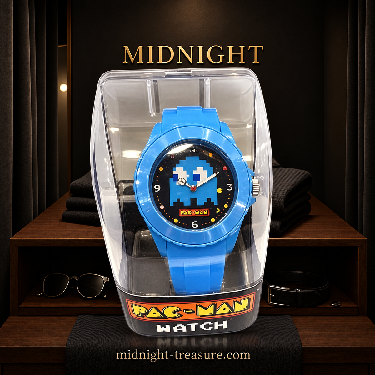 Montre analogique Pac-Man bleue avec fantôme pixelisé sur cadran noir et bracelet bleu