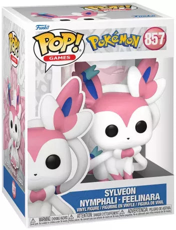 Funko Pop! Pokémon – Sylveon / Nymphali (N°857). Nymphali assis avec rubans roses et bleus, regard doux et design féerique. Figurine détaillée pour les fans Pokémon.