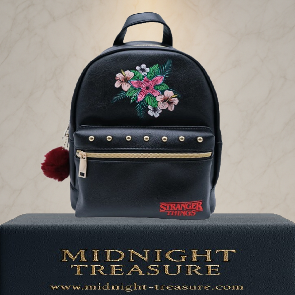 Sac à dos Demogorgon Stranger Things noir avec motif floral, licence officielle, dimensions 28 x 22 x 11 cm, design élégant inspiré de la série Netflix.