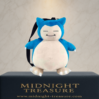 Sac à dos peluche Pokémon – Ronflex – 35 cm. Peluche douce représentant Ronflex avec bretelles réglables et fermeture zippée arrière. Accessoire mignon et pratique pour les fans de Pokémon.