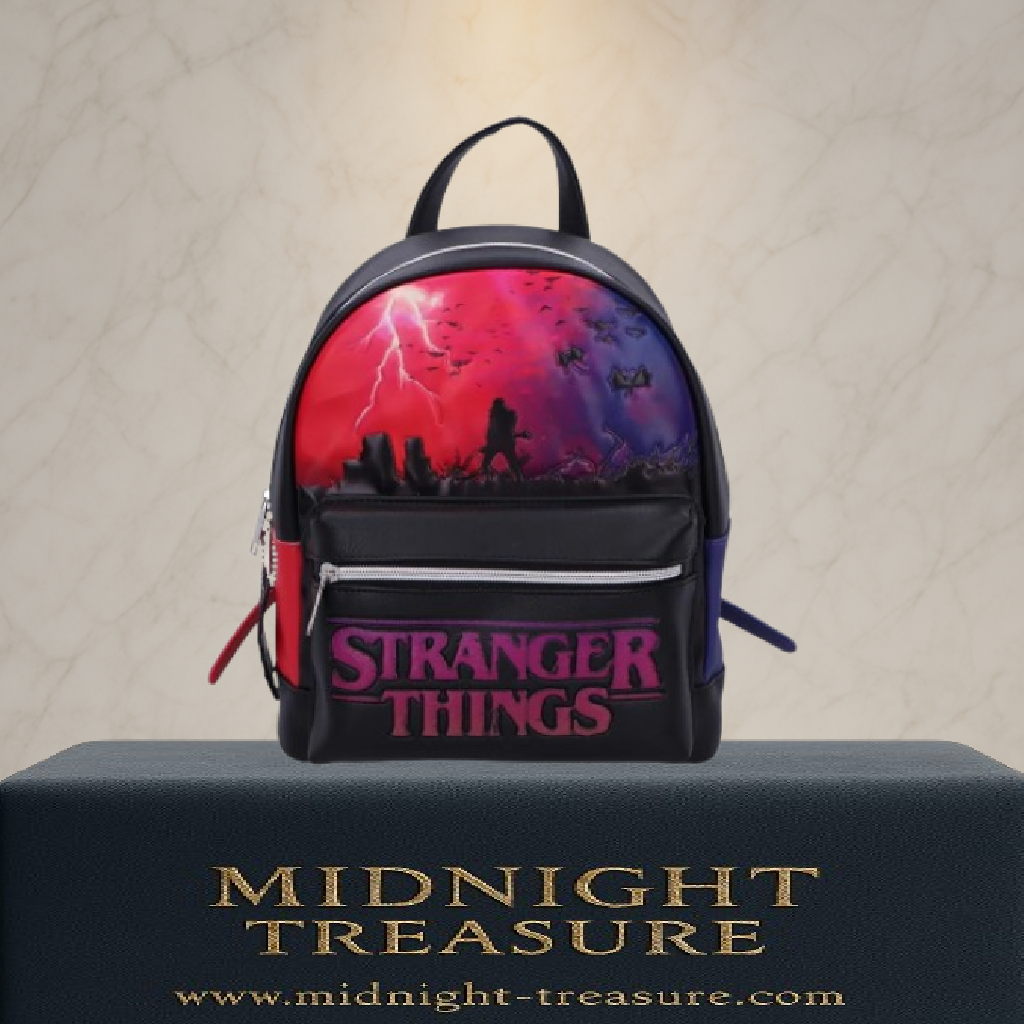 Sac à dos Stranger Things The Upside Down – environ 28 cm. Sac en simili cuir avec illustration de l’Upside Down, logo Stranger Things en relief et bretelles bicolores inspirées de la série Netflix.