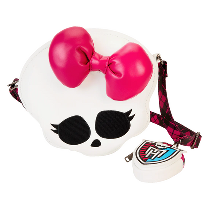 Sac Loungefly – Monster High – Ghoul Squad – 24 x 29,2 x 10,1 cm. Sac en forme de tête de mort avec nœud rose et bandoulière tartan. Un accessoire original pour les fans de Monster High.