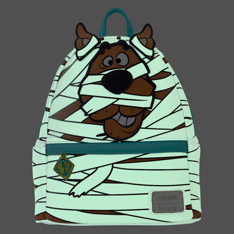 Sac à dos mini Loungefly – Scooby-Doo – Mummy Cosplay – 23 x 27 x 11 cm. Sac blanc et marron avec design de Scooby en momie, effet lumineux dans le noir et breloque logo Mystery Machine.

