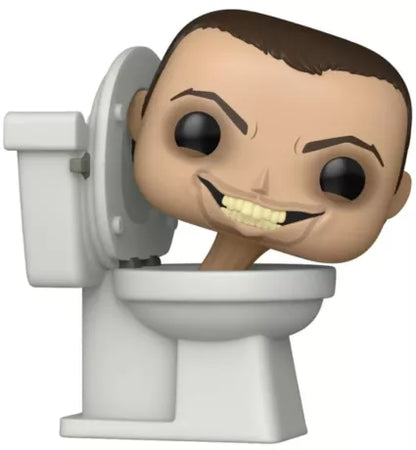 Funko Pop! Skibidi Toilet (N°1957). Figurine représentant le personnage culte avec tête humaine sortant d’une cuvette blanche. Une pièce fun et absurde inspirée de la web-série virale Skibidi Toilet.