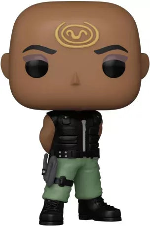 Funko Pop! Stargate SG-1 – Teal’c (n°1660). Teal’c bras croisés, tatouage Jaffa doré visible, dans sa tenue de combat. Une figurine charismatique et fidèle pour les fans de Stargate.