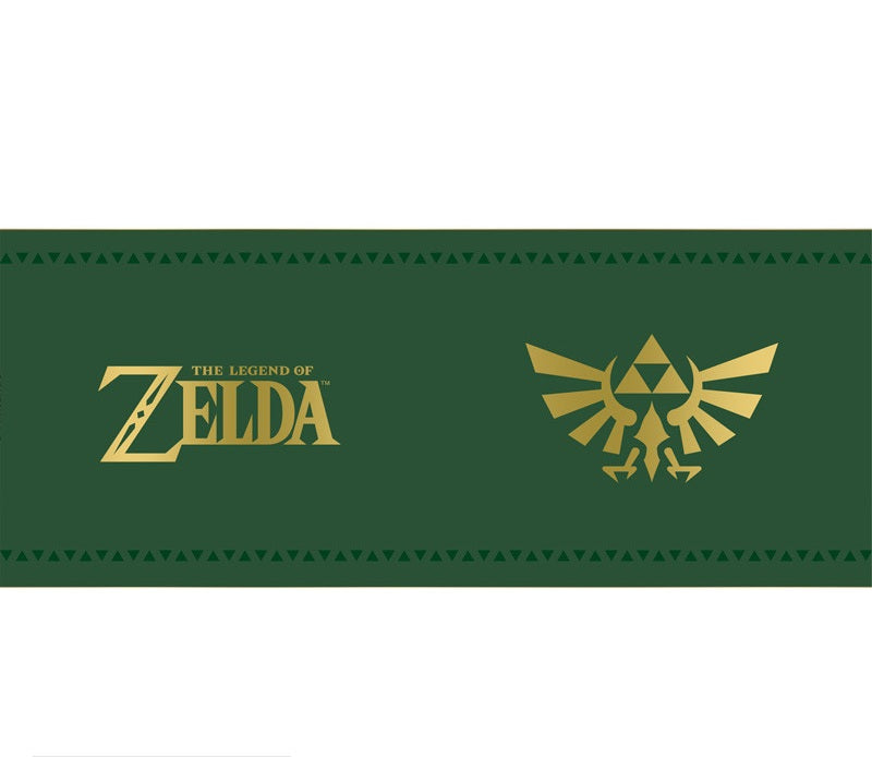 Mug The Legend of Zelda – Insigne d’Hyrule – 460 ml – ABYstyle. Mug en céramique vert et or, orné de la Triforce dorée, symbole mythique du royaume d’Hyrule.